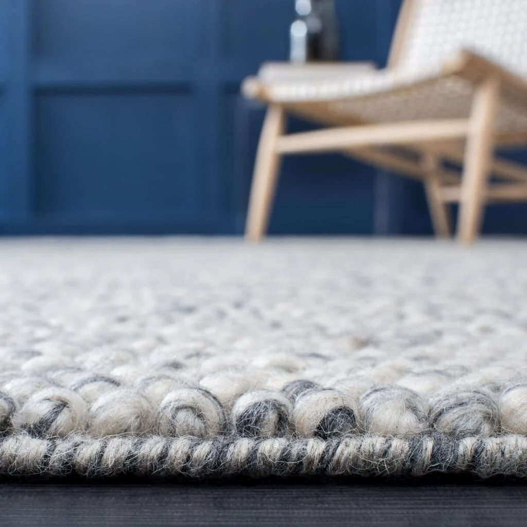 Pebble texture flatweave pure wool rug in a minimal lifestyle interior setting