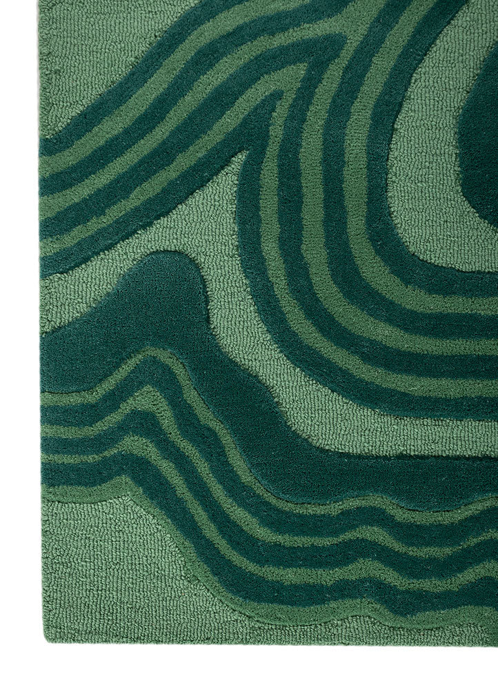 Texture detail of Cascade Wool Rug hand tufted wool rug with soft carved lines.