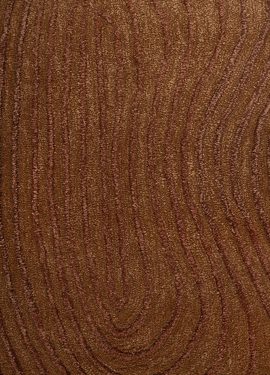 Full view of Clay Ripple Wool Rug featuring flowing ripple pattern in warm brown hand tufted wool texture.
