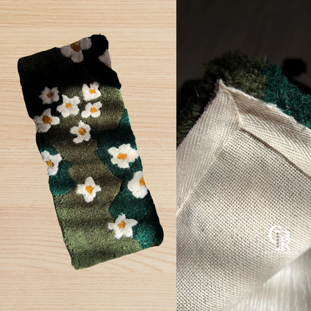 Hand-tufted green floral desk rug showing front daisy design and backing material side-by-side for quality detailing.