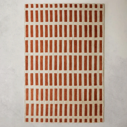 Full view of Gridline Terra Wool Rug hand tufted wool rug with warm terracotta grid pattern.