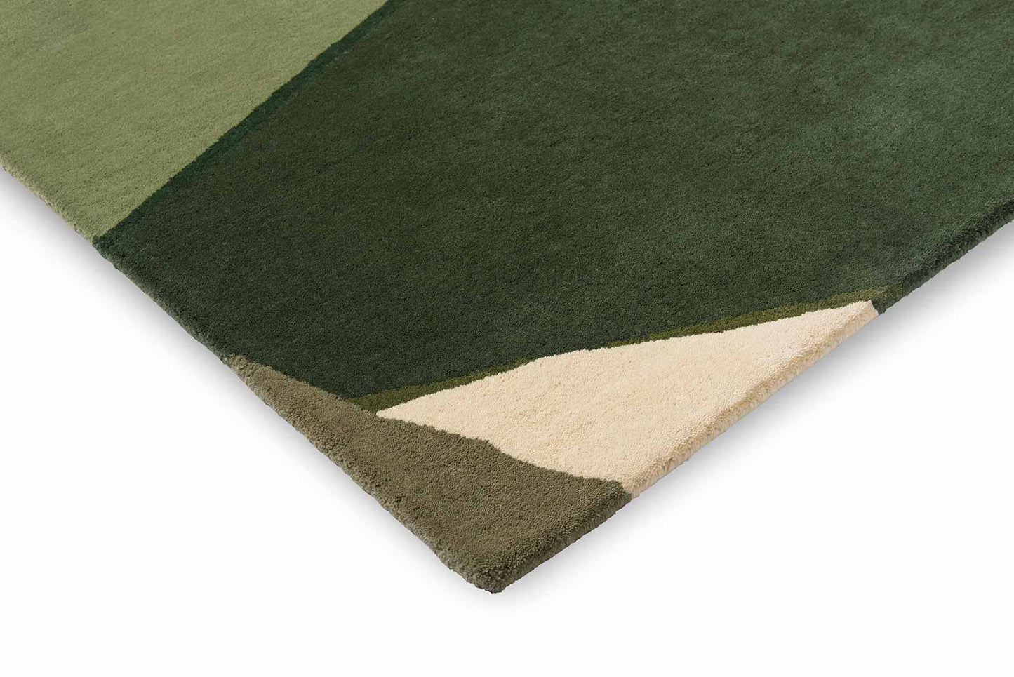 Corner folded view of Harlequin Sumi hand tufted wool rug highlighting thickness and premium wool finish