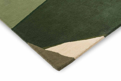 Corner folded view of Harlequin Sumi hand tufted wool rug highlighting thickness and premium wool finish