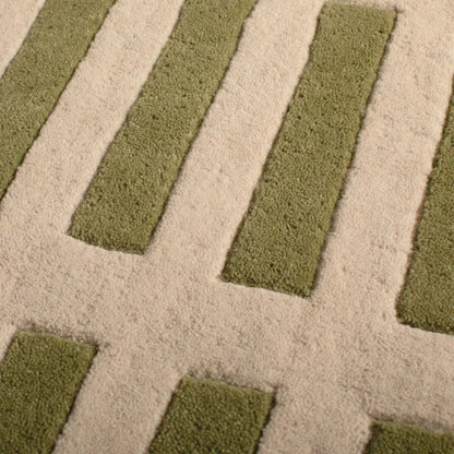 Close up texture detail of Lattice Wool Rug hand tufted wool rug with raised grid design.