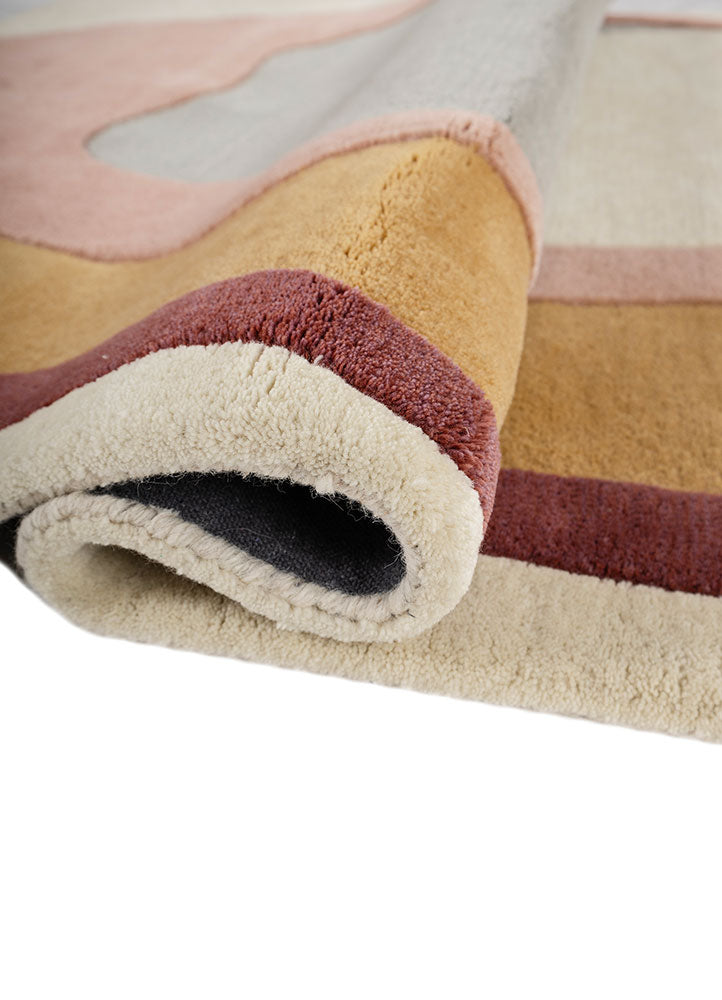 Folded corner of Muse Wool Rug hand tufted wool rug highlighting thickness.