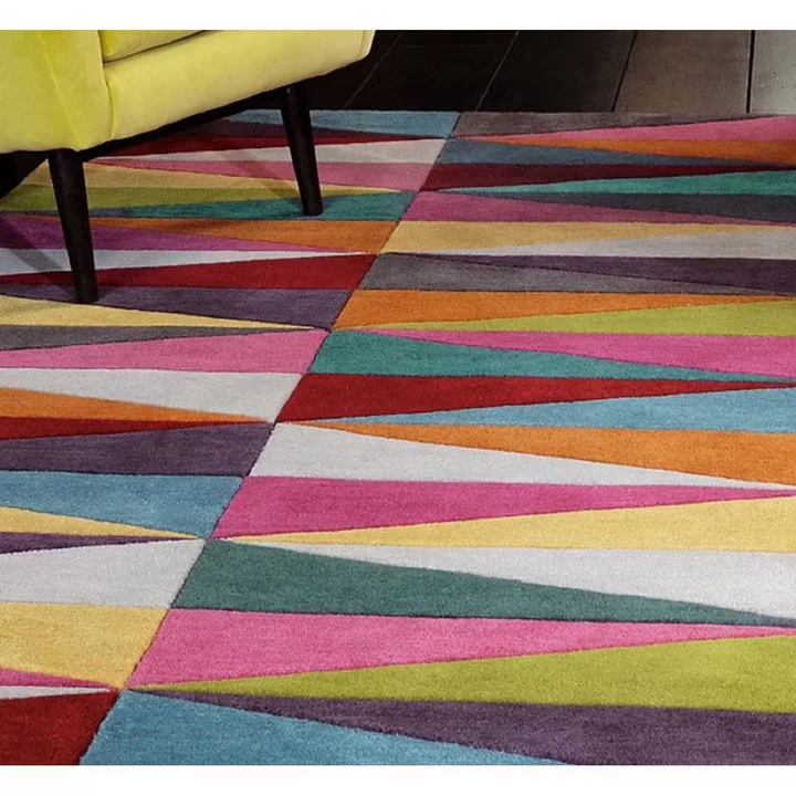 Prism Echo Multicolor Geometric hand tufted wool rug angled view showing sharp geometric pattern color contrast and wool texture.