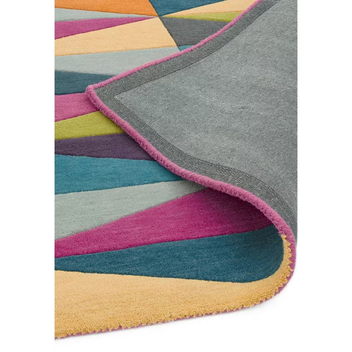 Folded corner detail of Prism Echo Multicolor Geometric hand tufted wool rug displaying thickness edge finish and wool quality