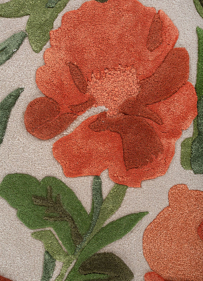 Hand tufted wool rug close view showing rose floral motifs fine detailing rich colors and soft textured wool surface.