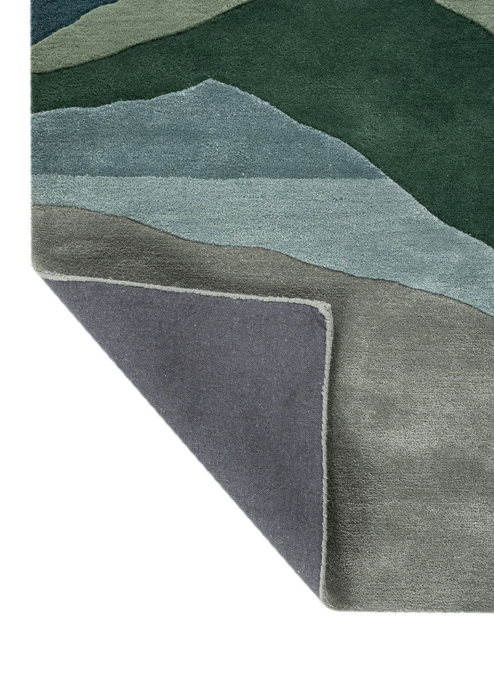 Corner fold view of Verdant Ridge hand tufted wool rug showing backing structure hand tufted finish and wool thickness.