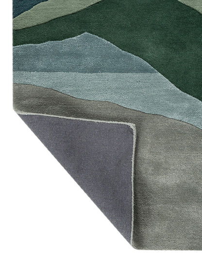 Corner fold view of Verdant Ridge hand tufted wool rug showing backing structure hand tufted finish and wool thickness.