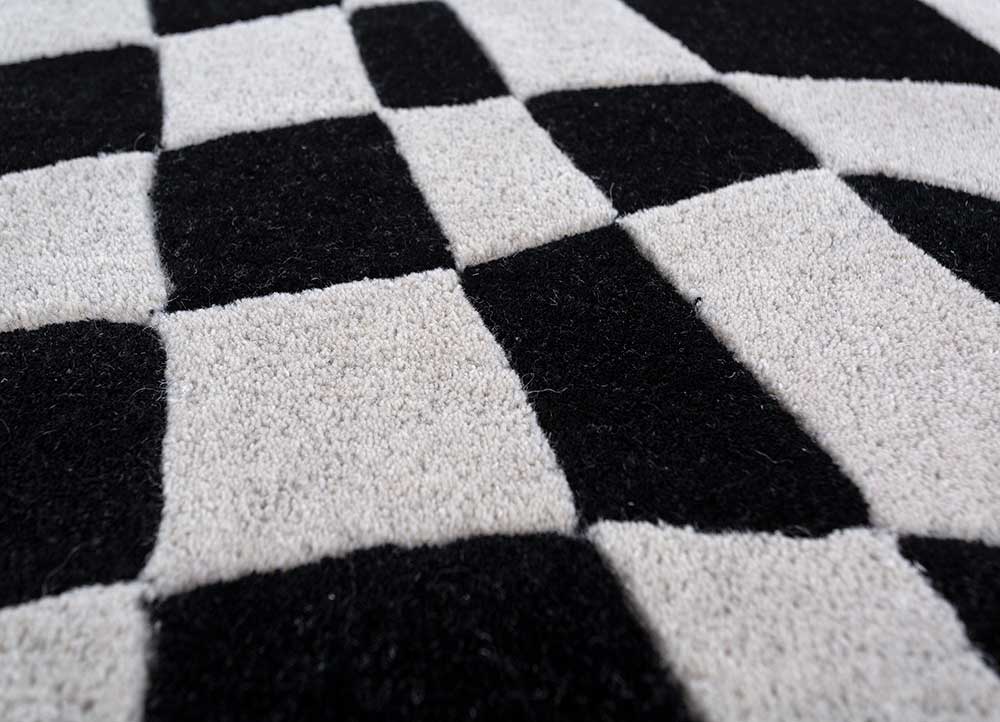 Close detailed texture of Abstract Optical hand tufted wool rug showing dense wool fibers.