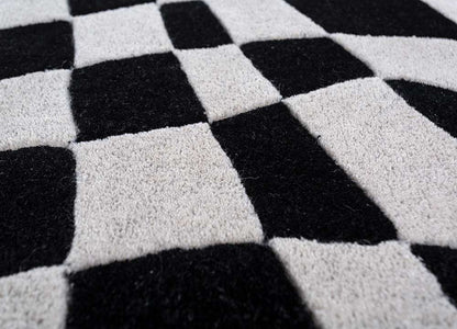 Close detailed texture of Abstract Optical hand tufted wool rug showing dense wool fibers.