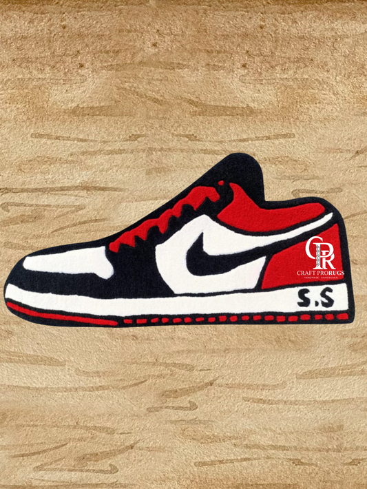 Front view of Air Jordan Red Hand-Tufted Rug featuring a bold red, black, and white sneaker design, perfect for modern floor décor.