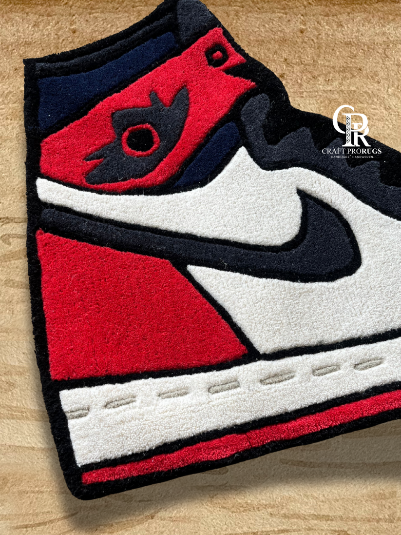 High-top Air Jordan Red Hand-Tufted Rug design featuring iconic sneaker styling and bold color contrast.