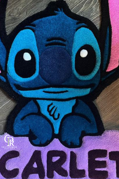 close view of Blue Alien hand-tufted name rug showing soft texture, vibrant colors, and detailed alien design