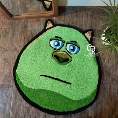 Full top view of Bored Face Rug showing complete green face design with blue eyes and soft texture