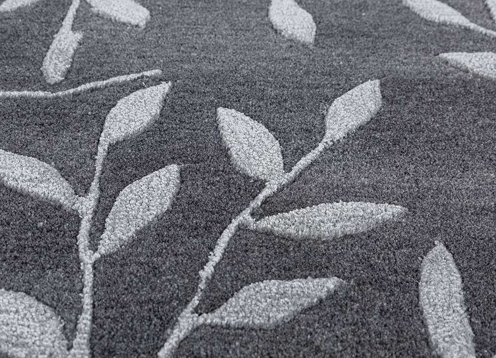 Close detailed texture of Botanical Vine hand tufted wool rug showing dense pile and craftsmanship.
