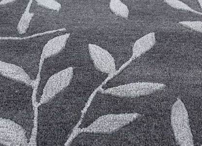 Close detailed texture of Botanical Vine hand tufted wool rug showing dense pile and craftsmanship.
