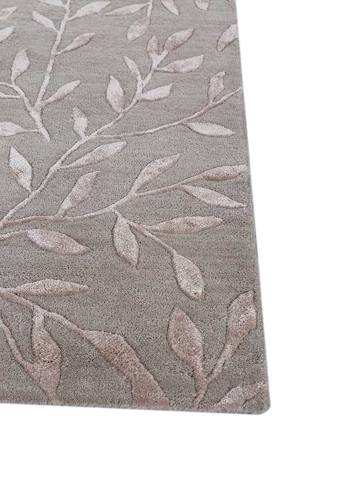 Corner close-up of Botanical Vine hand-tufted wool rug showing edge finish and pile depth.