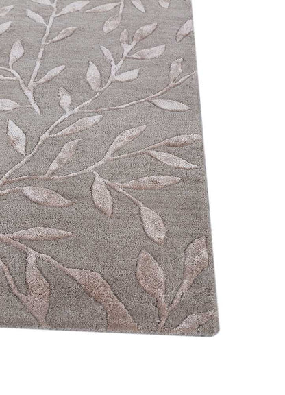 Corner close-up of Botanical Vine hand-tufted wool rug showing edge finish and pile depth.