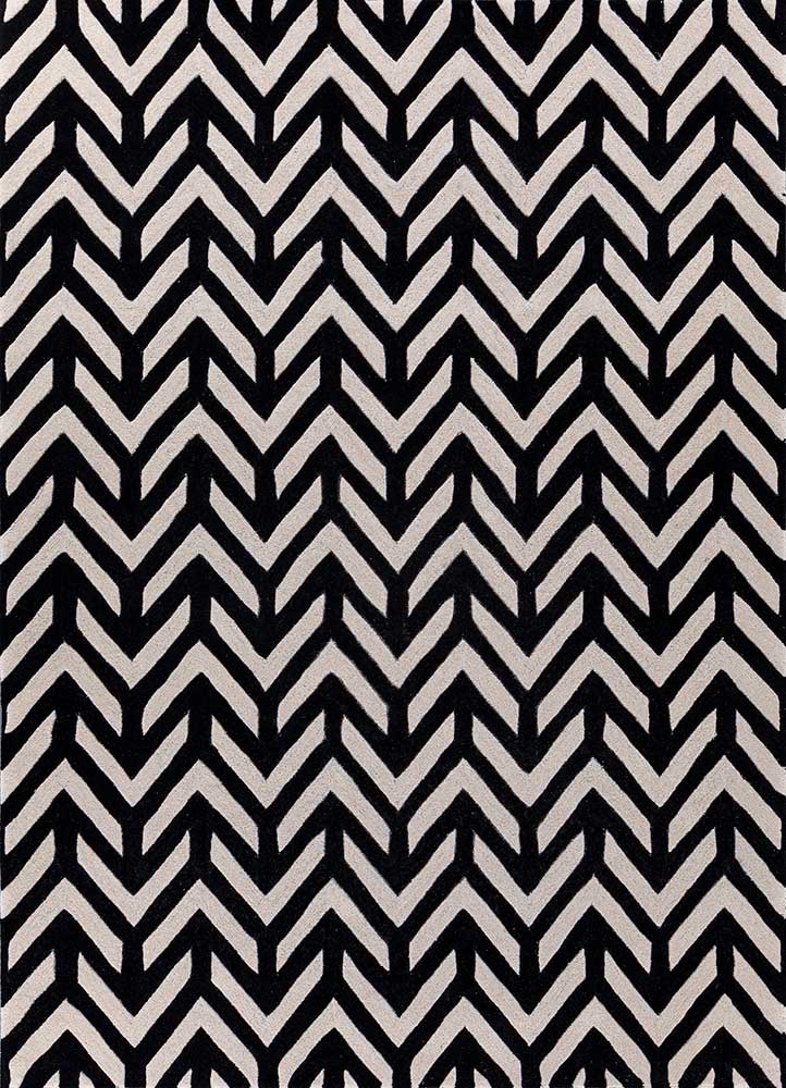 Hand tufted wool rug with black and ivory chevron pattern, modern zigzag design suitable for living room interiors.
