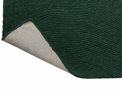 Back fold view of Echo Forest Solid hand tufted wool rug showing flexibility and durable hand tufted construction.