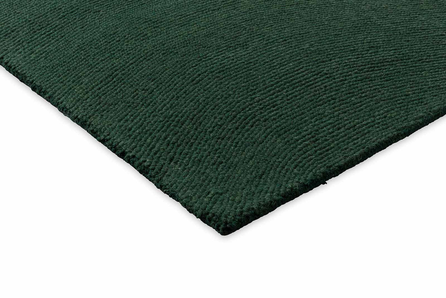 Corner detail of Echo Forest Solid hand tufted wool rug highlighting thickness and premium wool craftsmanship.