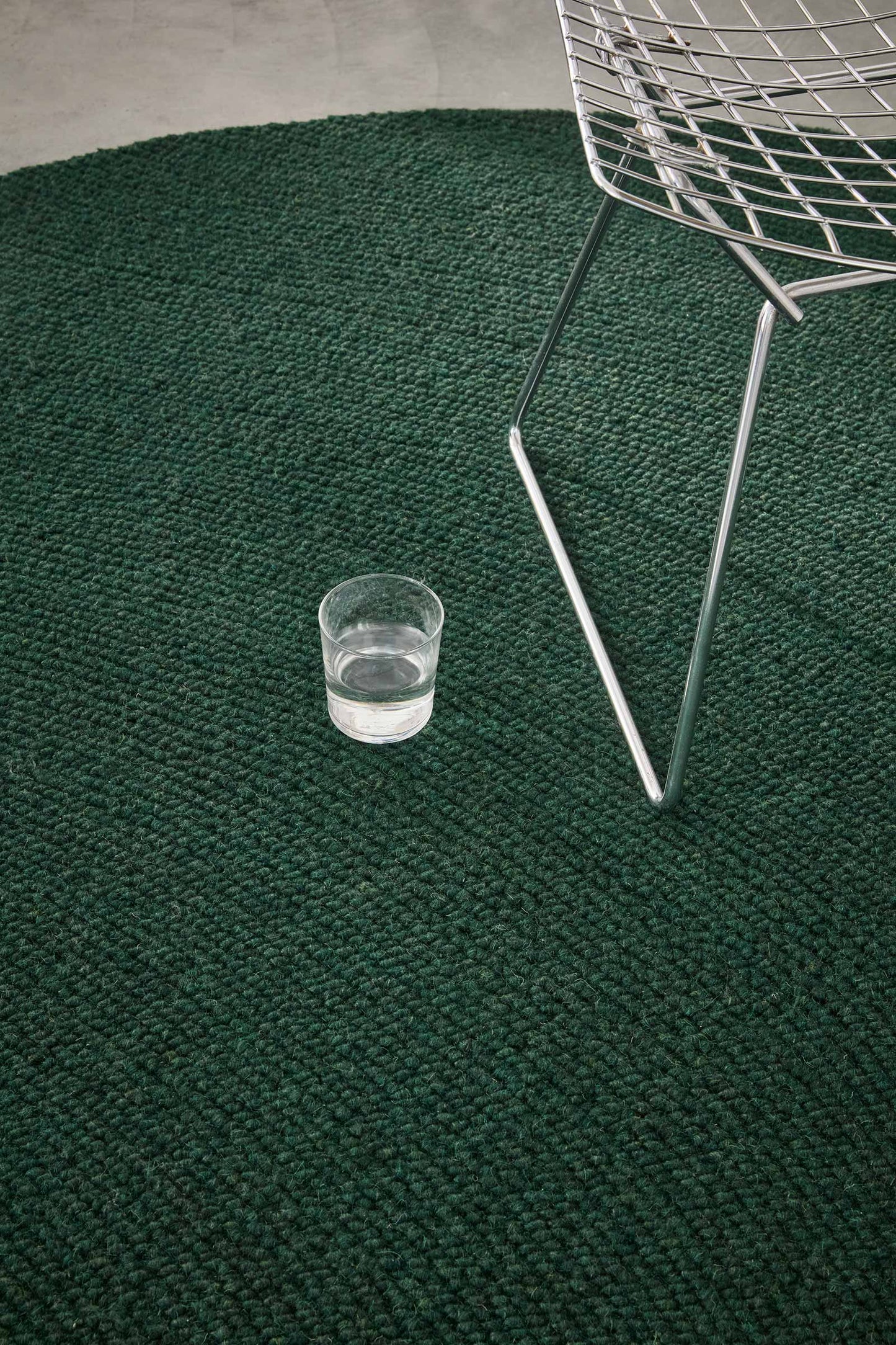 Oval Echo Forest Solid hand tufted wool rug with clean solid design and rich green wool surface.