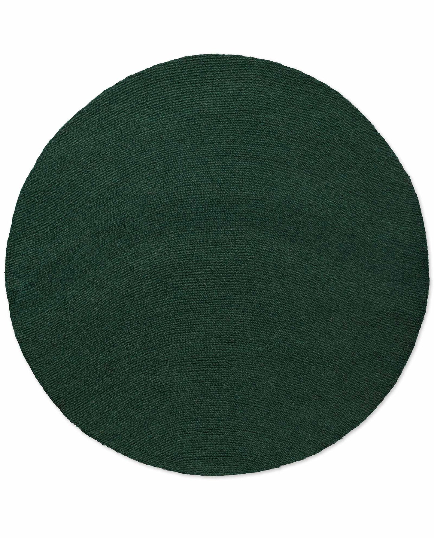 Round Echo Forest Solid hand tufted wool rug featuring smooth edges and uniform forest green wool texture.