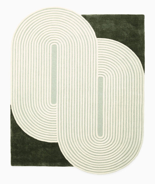 Elora Sage Oval hand tufted wool rug showing layered oval shape with soft sage green lines and modern design.