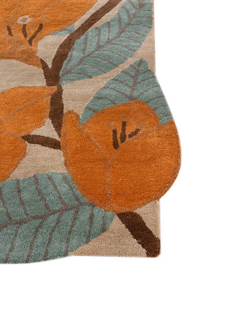 Corner close-up of Floral Vine hand tufted wool rug showing edge finish and pile.