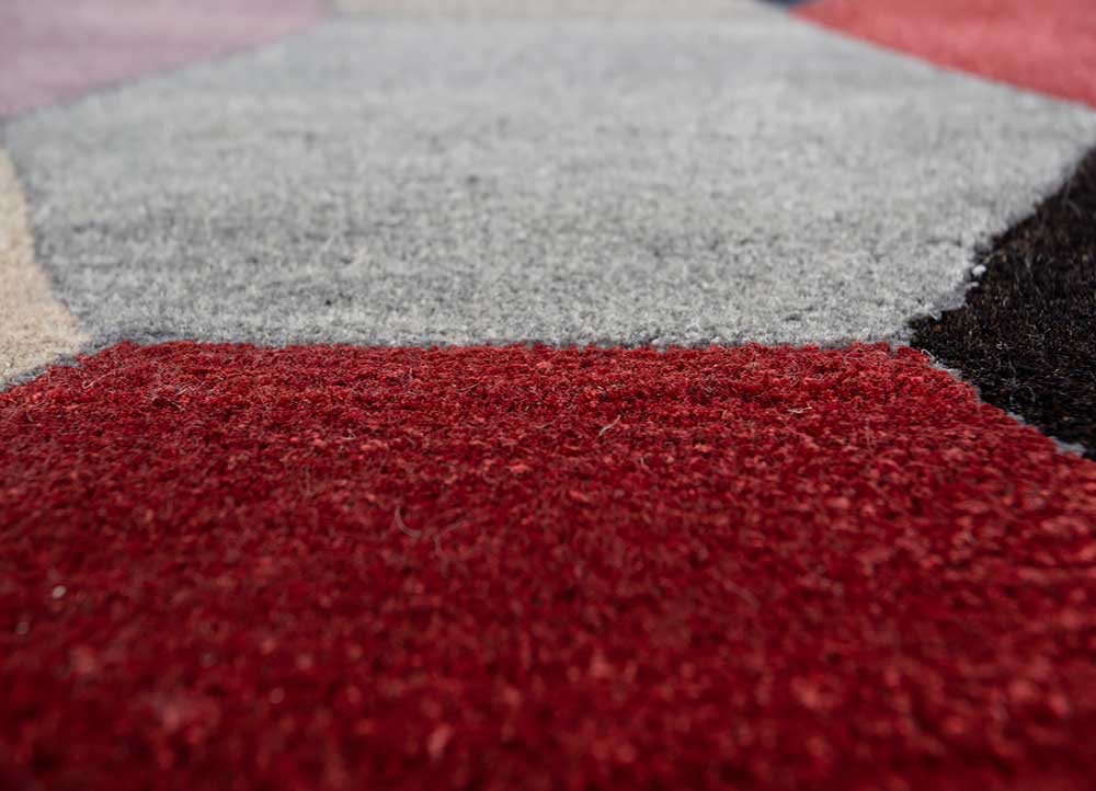 Close detailed texture of Geometric Mosaic hand tufted wool rug showing fibers and pattern