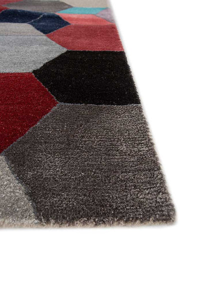 Corner close-up of Geometric Mosaic hand tufted wool rug showing edge finish.