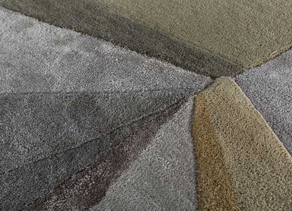 Detailed view of geometric spectrum hand-tufted wool rug highlighting abstract color blocks and clean modern pattern design.