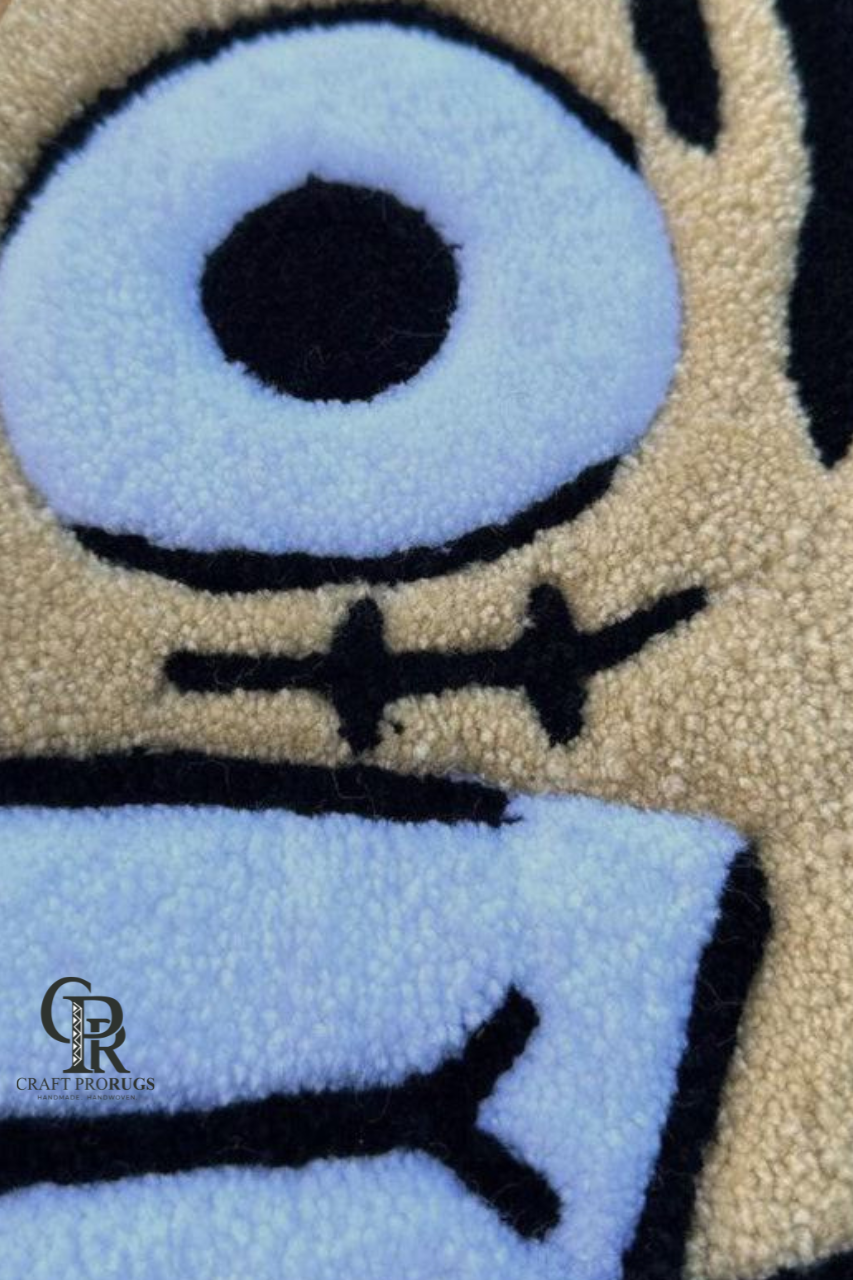 Close-up of the eye detailing on the hand-tufted Straw Hat Pirate Luffy inspired rug.