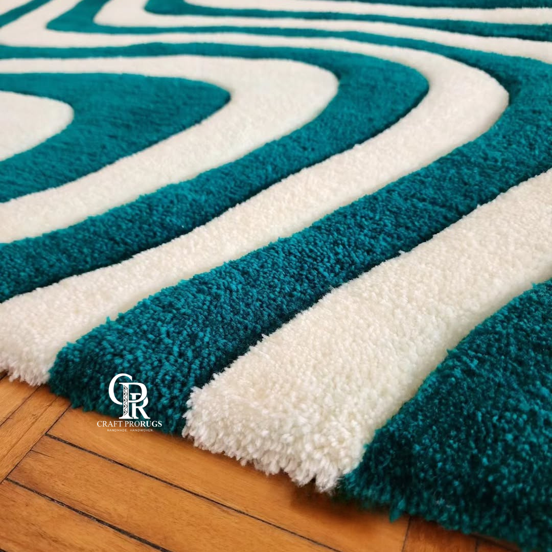 Side angle view of hand-tufted Teal & White Wavy Pattern Rug showing thickness and soft texture