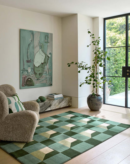 harlequin geometric rug placed in living room with sofa and plants showcasing modern interior.