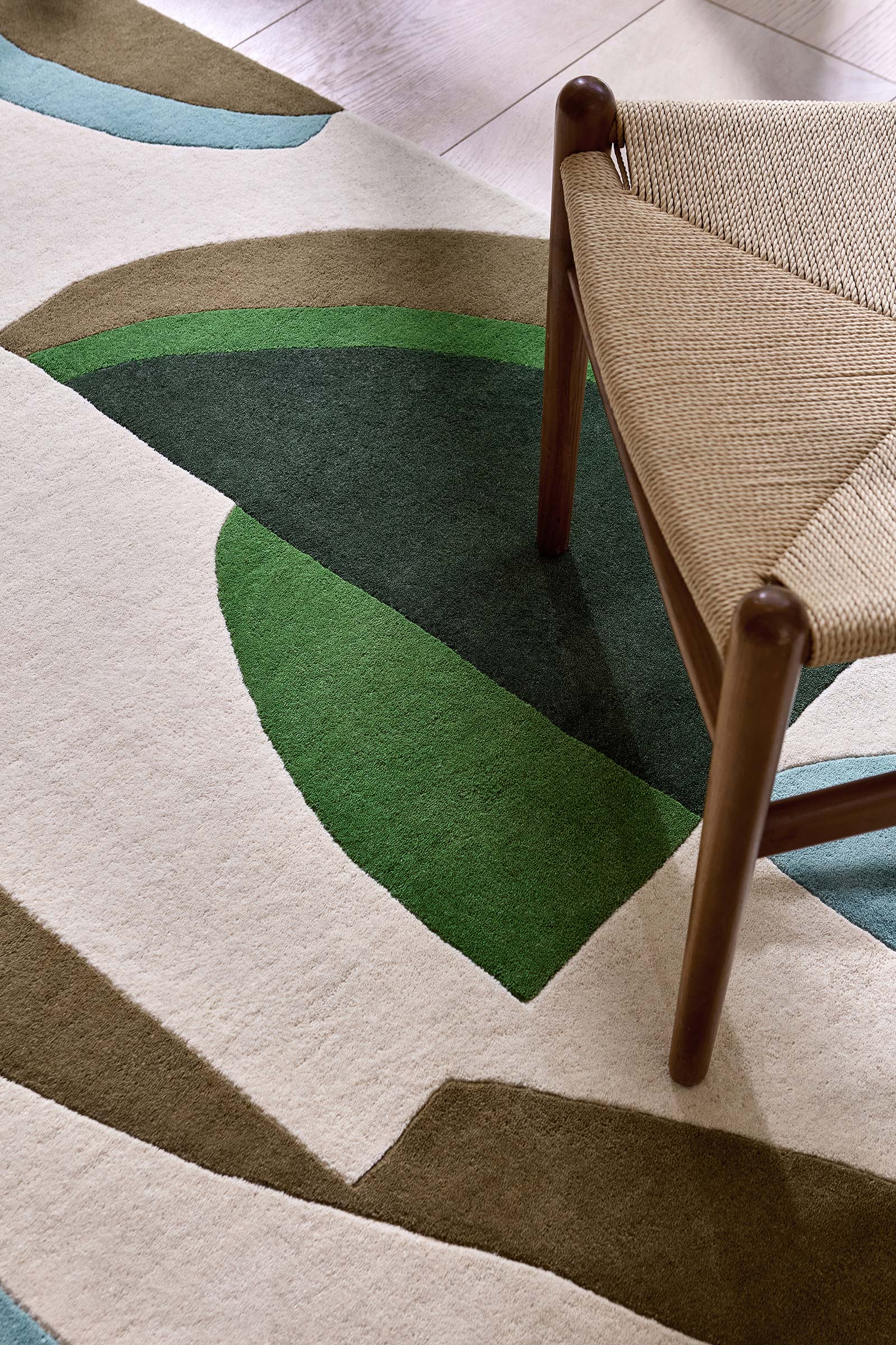 Close up texture view of Harlequin Torillo hand tufted wool rug highlighting dense wool pile and fine weaving detail.