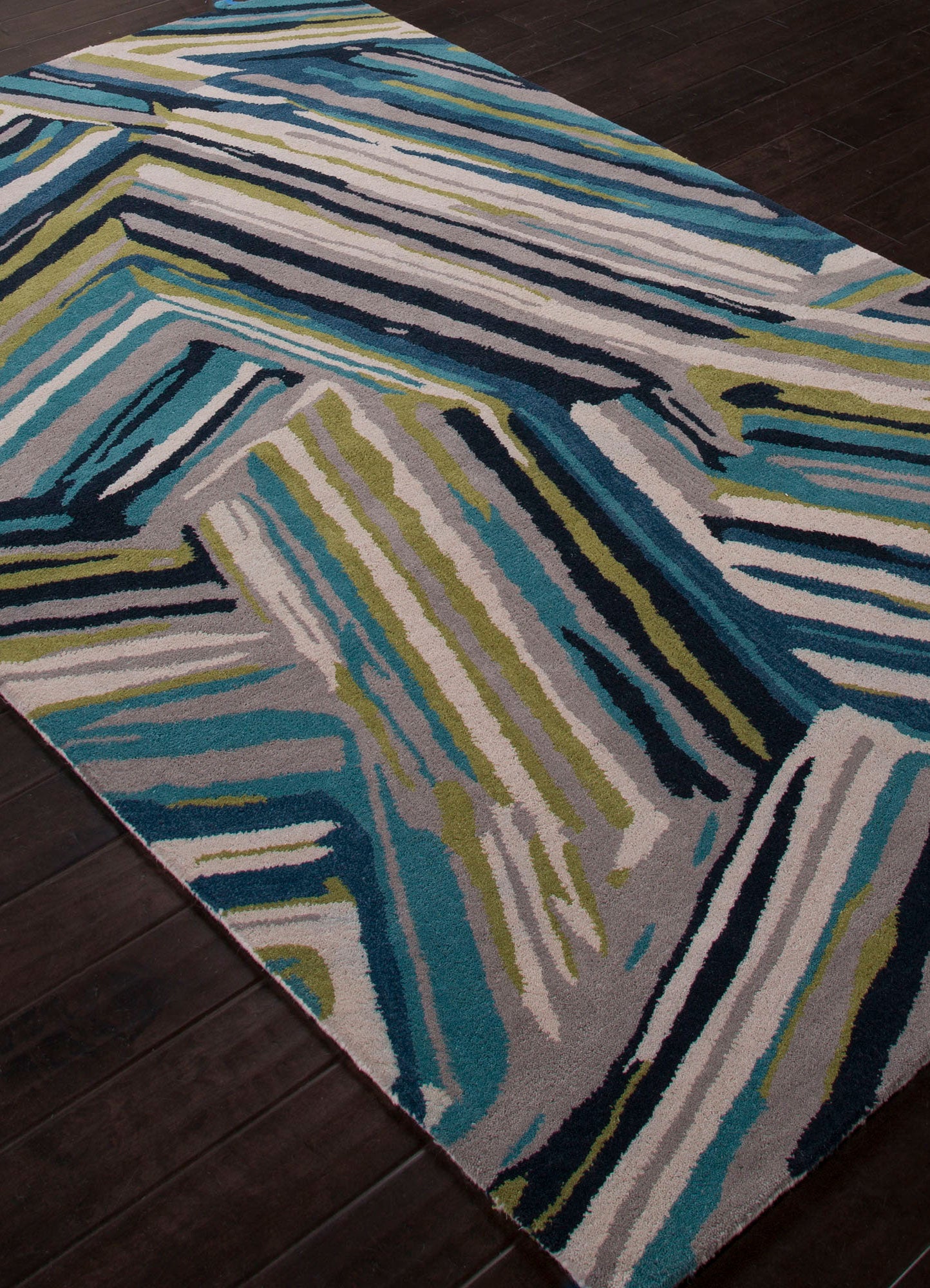 Angled close view of Linear Pattern hand tufted wool rug displaying layered linear strokes and rich wool texture