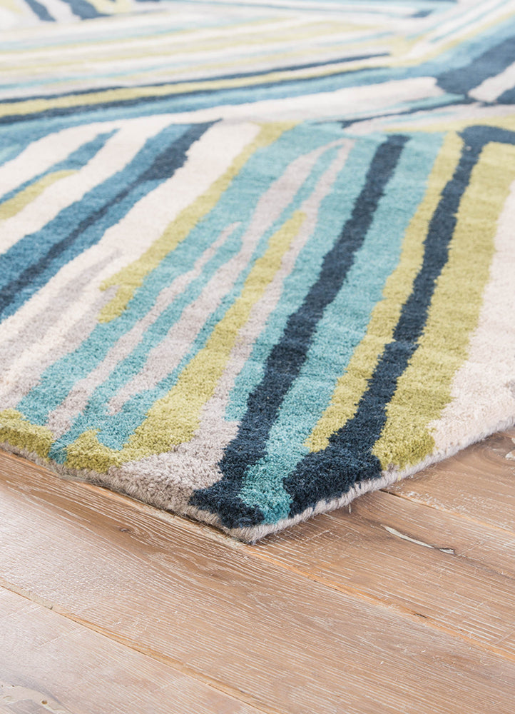 Corner fold of Linear Pattern hand tufted wool rug showing thickness flexibility and premium hand tufted wool quality.