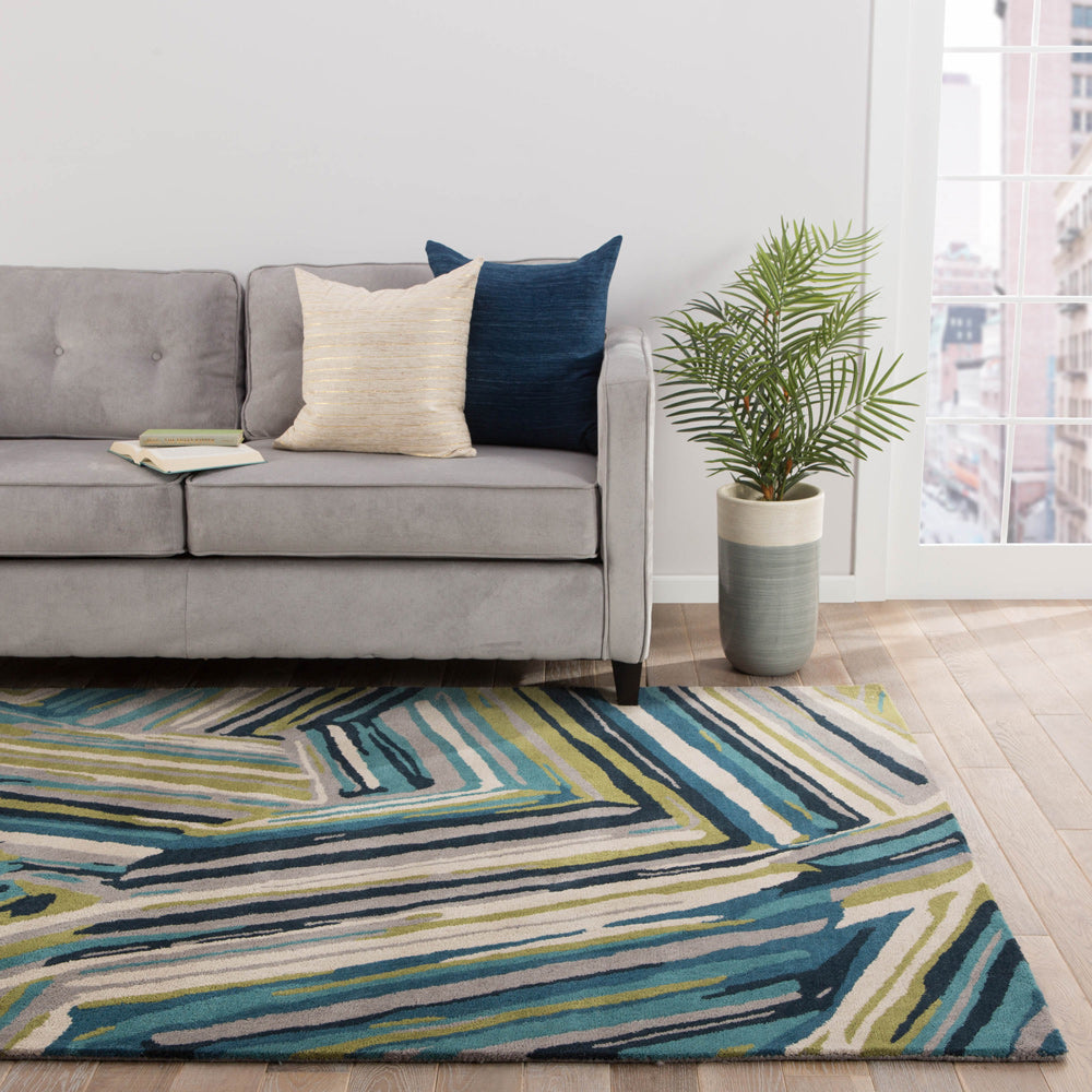 Linear Pattern hand tufted wool rug placed in a modern living room featuring multicolor linear design and textured wool surface