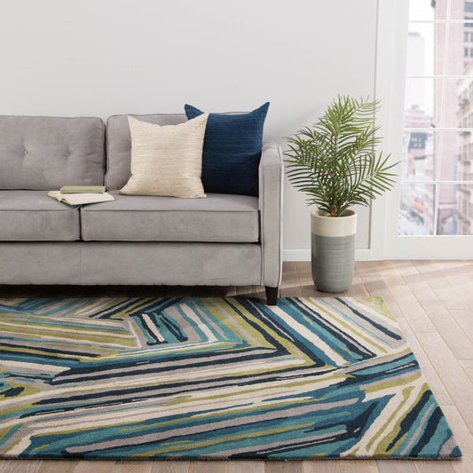 Linear Pattern hand tufted wool rug placed in a modern living room featuring multicolor linear design and textured wool surface