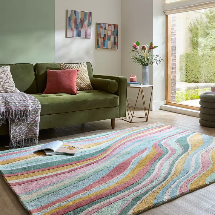Liora Pastel Wave Rug hand tufted wool rug in living room showing colorful pastel wave design