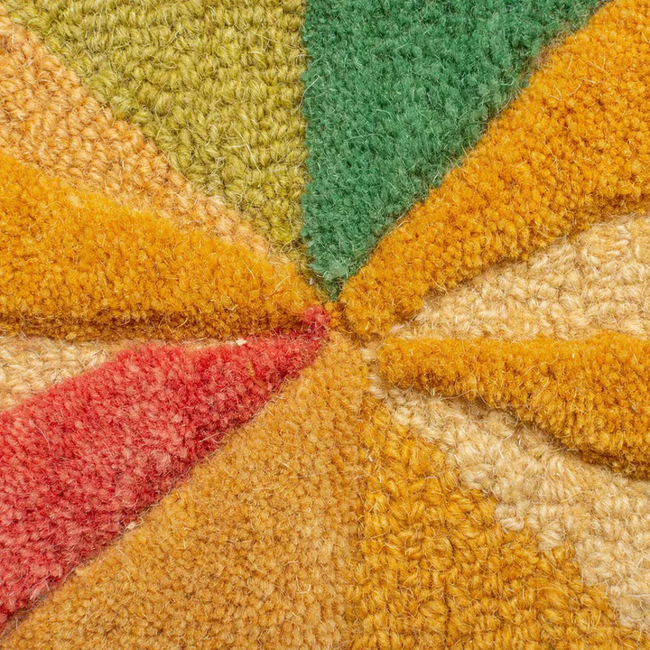 Close up of luma geometry hand tufted wool rug showing dense wool pile and multicolor geometric texture.
