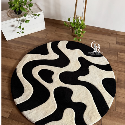 Monoloop hand tufted rug in black and white abstract design styled in a modern living room