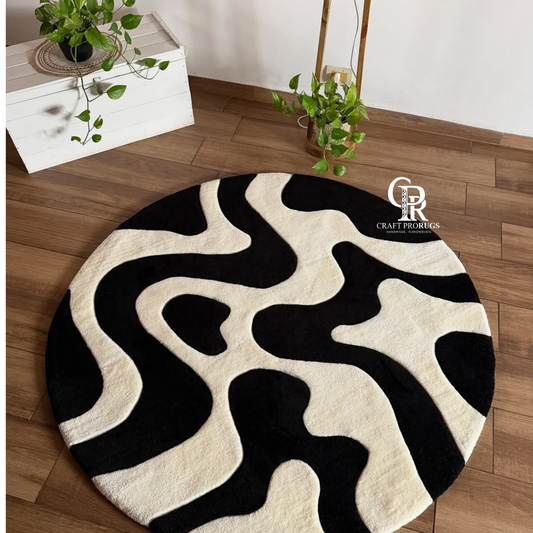 Monoloop hand tufted rug in black and white abstract design styled in a modern living room