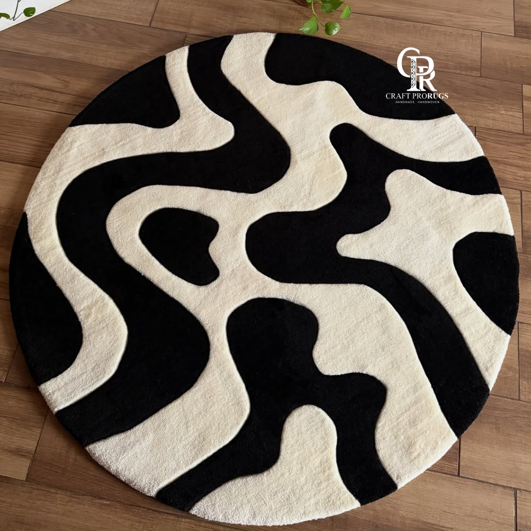 Black and white monoloop hand tufted rug with bold flowing wave pattern
