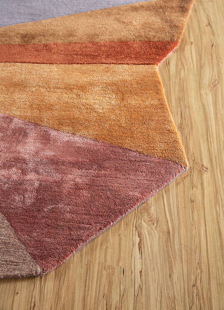 Edge detail of multicolor spectrum hand-tufted wool rug displaying clean geometric cuts and fine wool craftsmanship