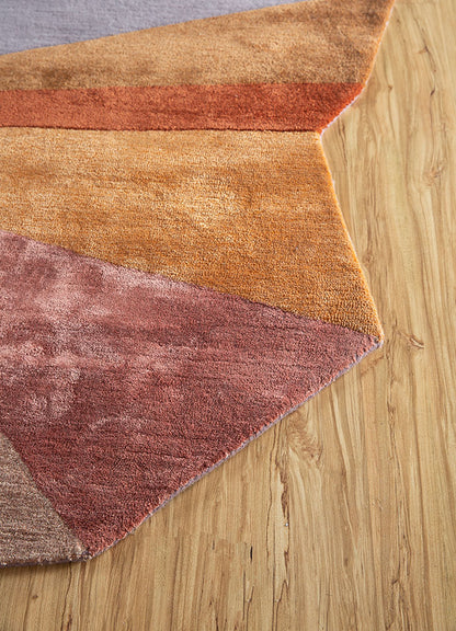 Edge detail of multicolor spectrum hand-tufted wool rug displaying clean geometric cuts and fine wool craftsmanship