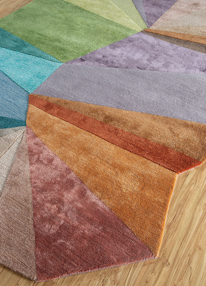 Top angle view of multicolor spectrum hand-tufted wool rug highlighting abstract geometric layout and balanced color tones